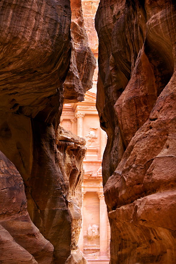 Tantalizing glimpses of the Treasury appear as the end of the Siq draws near.